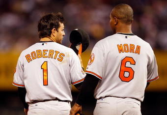 KANSAS CITY, MO - MAY 14:  Brian Roberts #1 of the Baltimore Orioles ta;lks with Melvin Mora #6 after the end of an inning during the game against the Kansas City Royals on May 14, 2009 at Kauffman Stadium in Kansas City, Missouri.  (Photo by Jamie Squire/Getty Images)