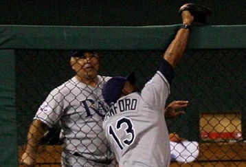 ST LOUIS, MO - JULY 14:  American League All-Star Carl Crawford of the Tampa Bay Rays robs a home run from National League All-Star Brad Hawpe of the Colorado Rockies during the 2009 MLB All-Star Game at Busch Stadium on July 14, 2009 in St Louis, Missouri.  (Photo by Dilip Vishwanat/Getty Images)