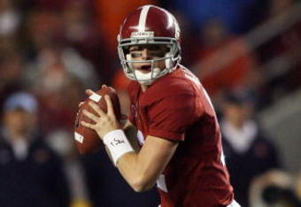 TUSCALOOSA, AL - NOVEMBER 29:  Quarterback Greg McElroy #12 of the Alabama Crimson Tide rolls out to pass against the Auburn Tigers at Bryant-Denny Stadium on November 29, 2008 in Tuscaloosa, Alabama. Alabama defeated Auburn 36-0.  (Photo by Doug Benc/Getty Images)