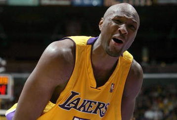 LOS ANGELES - DECEMBER 8:  Lamar Odom #7 of the Los Angeles Lakers gets emotional during the game against the Phoenix Suns during the game at Staples Center on December 8, 2004 in Los Angeles, California.  The Suns won 113-110.  NOTE TO USER: User expressly acknowledges and agrees that, by downloading and/or using this Photograph, user is consenting to the terms and conditions of the Getty Images License Agreement. (Photo by Jeff Gross/Getty Images)