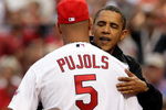 ST LOUIS, MO - JULY 14:  U.S. President Barack Obama waves hugs Albert Pujols of the St. Louis Cardinals after throwing out the first pitch at the 2009 MLB All-Star Game at Busch Stadium on July 14, 2009 in St Louis, Missouri.  (Photo by Jamie Squire/Getty Images)