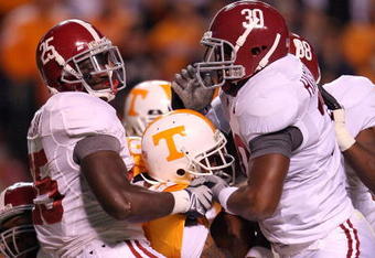 KNOXVILLE, TN - OCTOBER 25: Arian Foster #27 of the Tennessee Volunteers is tackled by Rolando McClain #25 and Dont'a Hightower #30 of the Alabama Crimson Tide during the game at Neyland Stadium on October 25, 2008 in Knoxville, Tennessee.  (Photo by Andy Lyons/Getty Images)