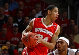 MILWAUKEE - MARCH 21: Guard Devin Harris #34  of the Wisconsin Badgers tries to turn the corner on guard Jaron Brown #4 of the Pittsburgh Panthers during the second round game of the NCAA Division I Men's Basketball Tournament at the Bradley Center on March 21, 2004 in Milwaukee, Wisconsin. Pittsburgh defeated Wisconsin 59-55. (Photo by Jonathan Daniel/Getty Images)