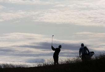 TURNBERRY, SCOTLAND - JULY 15:  Adam Scott of Australia hits his second shot on the 9th hole during a practice round prior to the 138th Open Championship on the Ailsa Course, Turnberry Golf Club on July 15, 2009 in Turnberry, Scotland.  (Photo by Andrew Redington/Getty Images)