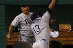 ST LOUIS, MO - JULY 14:  American League All-Star Carl Crawford of the Tampa Bay Rays robs a home run from National League All-Star Brad Hawpe of the Colorado Rockies during the 2009 MLB All-Star Game at Busch Stadium on July 14, 2009 in St Louis, Missouri.  (Photo by Dilip Vishwanat/Getty Images)