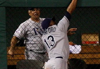 ST LOUIS, MO - JULY 14:  American League All-Star Carl Crawford of the Tampa Bay Rays robs a home run from National League All-Star Brad Hawpe of the Colorado Rockies during the 2009 MLB All-Star Game at Busch Stadium on July 14, 2009 in St Louis, Missouri.  (Photo by Dilip Vishwanat/Getty Images)
