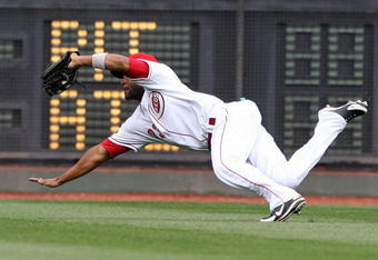 CINCINNATI - MARCH 31:  Corey Patterson #23 of the Cincinnati Reds dives to catch the ball during the game against the Arizona Diamondbacks on March 31, 2008 at Great American Ball Park in Cincinnati, Ohio.  (Photo by Andy Lyons/Getty Images)  