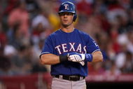 ANAHEIM, CA - JULY 08:  Michael Young  #10 of the Texas Rangers adjusts his gloves in the game against the Los Angeles Angels of Anaheim on July 8, 2009 at Angel Stadium in Anaheim, California.  The Rangers won 8-1.  (Photo by Stephen Dunn/Getty Images)