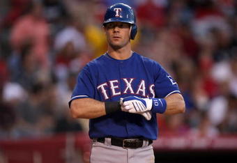 ANAHEIM, CA - JULY 08:  Michael Young  #10 of the Texas Rangers adjusts his gloves in the game against the Los Angeles Angels of Anaheim on July 8, 2009 at Angel Stadium in Anaheim, California.  The Rangers won 8-1.  (Photo by Stephen Dunn/Getty Images)