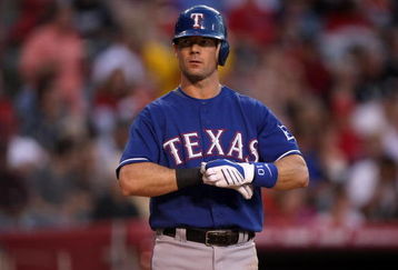 ANAHEIM, CA - JULY 08:  Michael Young  #10 of the Texas Rangers adjusts his gloves in the game against the Los Angeles Angels of Anaheim on July 8, 2009 at Angel Stadium in Anaheim, California.  The Rangers won 8-1.  (Photo by Stephen Dunn/Getty Images)