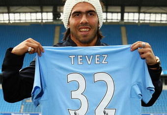 MANCHESTER, ENGLAND - JULY 14:  Carlos Tevez poses as he is unveilled at the City of Manchester Stadium after signing for Manchester City on July 14, 2009 in Manchester, England.  (Photo by Matthew Lewis/Getty Images)