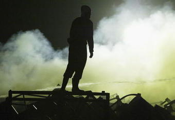 UTSUNOMIYA, JAPAN - SEPTEMBER 9:  Japanese firefighter stands amongst dedris at a Bridgestone Corp tire plant at the Bridgestone Tochigi factory in Kuroiso on September 9. 2003 in Utsunomiya, Japan. The fire broke out at a facility for mixing chemicals and rubber forcing nearby residents to evacuate,  (Photo by koichi kamoshida/Getty Images)