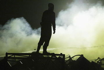 UTSUNOMIYA, JAPAN - SEPTEMBER 9:  Japanese firefighter stands amongst dedris at a Bridgestone Corp tire plant at the Bridgestone Tochigi factory in Kuroiso on September 9. 2003 in Utsunomiya, Japan. The fire broke out at a facility for mixing chemicals and rubber forcing nearby residents to evacuate,  (Photo by koichi kamoshida/Getty Images)