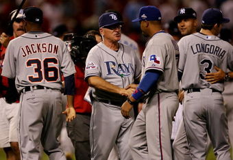 ST LOUIS, MO - JULY 14:  American League All-Star manager Joe Maddon of the Tampa Bay Rays celebrates with his team after winning the 2009 MLB All-Star Game at Busch Stadium on July 14, 2009 in St Louis, Missouri.  (Photo by Dilip Vishwanat/Getty Images)