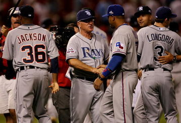 ST LOUIS, MO - JULY 14:  American League All-Star manager Joe Maddon of the Tampa Bay Rays celebrates with his team after winning the 2009 MLB All-Star Game at Busch Stadium on July 14, 2009 in St Louis, Missouri.  (Photo by Dilip Vishwanat/Getty Images)