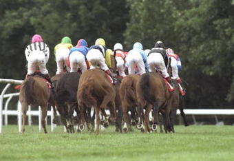 20 Sep 1997:  The horses and riders go round the first bend at Ayr Racecourse in Ayr, Scotland. \ Mandatory Credit: Julian Herbert /Allsport