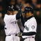 SEATTLE - APRIL 15:  Ichiro Suzuki (R) of the Seattle Mariners is congratulated by Ken Griffey, Jr. after hitting a grand slam against the Los Angeles Angels of Anaheim at Safeco Field April 15, 2009 in Seattle, Washington. The hit tied Suzuki with Isao Harimoto, the current all-time hits leader among Japanese players. All Major League Baseball players are wearing #42 in honor of Jackie Robinson day.  (Photo by Otto Greule Jr/Getty Images)
