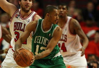 CHICAGO - APRIL 23: Gabe Pruitt #13 of the Boston Celticslooks to pass under pressure from Aaron Gray #34 of the Chicago Bulls in Game Three of the Eastern Conference Quarterfinals during the 2009 NBA Playoffs at the United Center on April 23, 2009 in Chicago, Illinois. The Celtics defeated the Bulls 107-86. NOTE TO USER: User expressly acknowledges and agreees that, by downloading and/or using this Photograph, User is consenting to the terms and conditions of the Getty Images License Agreement. (Photo by Jonathan Daniel/Getty Images)