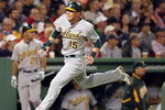 BOSTON - JULY 07:  Ryan Sweeney #15 of the Oakland Athletics scores a run in the fifth inning against the Boston Red Sox on July 7, 2009 at Fenway Park in Boston, Massachusetts.  (Photo by Elsa/Getty Images)