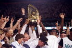 26 Oct 1997:  General view of players for the Florida Marlins holding the trophy after the seventh game of the World Series against the Cleveland Indians at Pro Player Stadium in Miami, Florida.  The Marlins won the game 3-2 and took the series. Mandatory Credit: Jed Jacobsohn  /Allsport