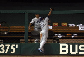 ST LOUIS, MO - JULY 14:  American League All-Star Carl Crawford of the Tampa Bay Rays robs a home run from National League All-Star Brad Hawpe of the Colorado Rockies during the 2009 MLB All-Star Game at Busch Stadium on July 14, 2009 in St Louis, Missouri.  (Photo by Dilip Vishwanat/Getty Images)