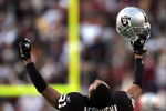 WASHINGTON - NOVEMBER 20:  Oakland Raiders cornerback Nnamdi Asomugha #21 celebrates after the Raiders recovered a game winning fumble in the fourth quarter on November 20, 2005 at Fed Ex Field in Landover, Maryland.  (Photo by Win McNamee/Getty Images)