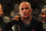 LAS VEGAS - JULY 11:  Georges St. Pierre celebrates his victory against Thiago Alves during their welterweight title bout during UFC 100 on July 11, 2009 in Las Vegas, Nevada. St. Pierre defeated Alves by unanimous decision.  (Photo by Jon Kopaloff/Getty Images)