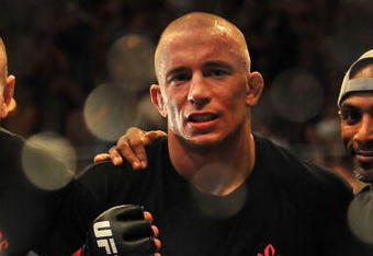 LAS VEGAS - JULY 11:  Georges St. Pierre celebrates his victory against Thiago Alves during their welterweight title bout during UFC 100 on July 11, 2009 in Las Vegas, Nevada. St. Pierre defeated Alves by unanimous decision.  (Photo by Jon Kopaloff/Getty Images)