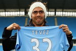 MANCHESTER, ENGLAND - JULY 14:  Carlos Tevez poses as he is unveilled at the City of Manchester Stadium after signing for Manchester City on July 14, 2009 in Manchester, England.  (Photo by Matthew Lewis/Getty Images)