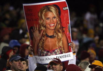 LANDOVER, MD - DECEMBER 30:  A Washington Redskins fan holds up sign including a picture of Jessica Simpson during the game against the Dallas Cowboys on December 30, 2007 at FedEx Field in Landover, Maryland.  (Photo by Nick Laham/Getty Images)
