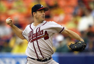 QUEENS, NY- SEPTEMBER 1:  Greg Maddux #31 of the Atlanta Braves pitches against the New York Mets during the game at Shea Stadium on September 1, 2003 in Queens, New York. The Mets defeated the Braves 3-2. (Photo by Chris Trotman/Getty Images)