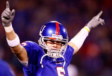 KANSAS CITY, MO - NOVEMBER 24:  Quarterback Todd Reesing #5 of the Kansas Jayhawks gets the crowd fired up during team introductions prior to the start game against the Missouri Tigers at Arrowhead Stadium November 24, 2007 in Kansas City, Missouri.  (Photo by Jamie Squire/Getty Images)