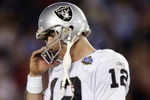 SAN DIEGO - JANUARY 26:  Rich Gannon #12 of the Oakland Raiders adjusts his helmet against the Tampa Bay Buccaneers during Super Bowl XXXVII on January 26, 2003 at Qualcomm Stadium in San Diego, California.  The Buccaneers defeated the Raiders 48-21.  (Photo by Brian Bahr/Getty Images)