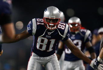 FOXBORO, MA - OCTOBER 20: Randy Moss #81 the New England Patriots celebrates a touchdown by teammate Sammy Morris #34 against the Denver Broncos at Gillette Stadium on October 20, 2008 in Foxboro, Massachusetts. (Photo by Jim Rogash/Getty Images)