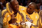 LOS ANGELES, CA - NOVEMBER 18:  Lamar Odom #7 (L) and Kobe Bryant #24 of the Los Angeles Lakers have a playful moment on the bench after Odom fouled out of the game with the Chicago Bulls at Staples Center November 18, 2008 in Los Angeles, California.  The Lakers won 116-109.    NOTE TO USER: User expressly acknowledges and agrees that, by downloading and/or using this Photograph, user is consenting to the terms and conditions of the Getty Images License Agreement.  (Photo by Stephen Dunn/Getty Images)