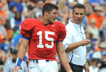 GAINESVILLE, FL - APRIL 18: Quarterback Tim Tebow #15 of the University of Florida talks with coach Urban Meyer during the spring football Orange and Blue game April 18, 2009 at Ben Hill Griffin Stadium in Gainesville, Florida.  (Photo by Al Messerschmidt/Getty Images)