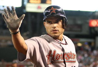 PHOENIX - JUNE 14:  Ivan Rodriguez #12 of the Houston Astros congratulates teammate Miguel Tejada (not pictured) after Tejada scored on a sacrafice fly hit by Rodriguez during the sixth inning of the major league baseball game against the Arizona Diamondbacks at Chase Field on June 14, 2009 in Phoenix, Arizona. The Astros defeated the Diamondbacks 8-3.  (Photo by Christian Petersen/Getty Images)