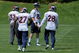 ENGLEWOOD, CO - MAY 03:  Quarterback Kyle Orton #8 particiaptes in practice during Denver Broncos Minicamp along with running backs LaMont Jordan #32, Knowshon Moreno #27 and Correll Buckhalter #28 at the Broncos training facility on May 3, 2009 in Englewood, Colorado. Moreno was the Broncos first round draft pick in the 2009 draft.  (Photo by Doug Pensinger/Getty Images)