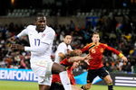 BLOEMFONTEIN, SOUTH AFRICA - JUNE 24:  Jozy Altidore #17 of USA takes a shot on goal Carles Puyol #5 of Spain during the FIFA Confederations Cup Semi Final match between Spain and USA at the Free State stadium on June 24, 2009 in Bloemfontein, South Africa. At left is Xabi Alonso #14 od Spain.  (Photo by Kevork Djansezian/Getty Images)