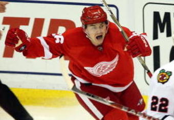 DETROIT - MAY 19:  Jiri Hudler #26 of the Detroit Red Wings celebrates after his teammate Mikael Samuelsson #37 scored the game-winning goal in overtime against the Chicago Blackhawks during Game Two of the Western Conference Championship Round of the 2009 Stanley Cup Playoffs on May 19, 2009 at Joe Louis Arena in Detroit, Michigan. The Red WIngs won 3-2 in overtime to take a 2-0 series lead.  (Photo by Claus Andersen/Getty Images)