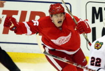 DETROIT - MAY 19:  Jiri Hudler #26 of the Detroit Red Wings celebrates after his teammate Mikael Samuelsson #37 scored the game-winning goal in overtime against the Chicago Blackhawks during Game Two of the Western Conference Championship Round of the 2009 Stanley Cup Playoffs on May 19, 2009 at Joe Louis Arena in Detroit, Michigan. The Red WIngs won 3-2 in overtime to take a 2-0 series lead.  (Photo by Claus Andersen/Getty Images)