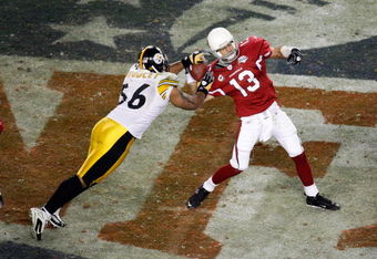 TAMPA, FL - FEBRUARY 01:  Quarterback Kurt Warner #13 of the Arizona Cardinals fumbles the ball with :15 seconds to play as he is sacked by LaMarr Woodley #56 of the Pittsburgh Steelers during Super Bowl XLIII on February 1, 2009 at Raymond James Stadium in Tampa, Florida. Steelers won 27-23. (Photo by Doug Benc/Getty Images)