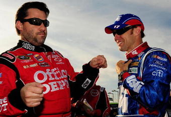 JOLIET, IL - JULY 11:  Tony Stewart (L), driver of the #14 Office Depot 'Back to School' Chevrolet, talks with Matt Kenseth, driver of the #17 USG Sheetrock Ford, prior to the start the NASCAR Sprint Cup Series LifeLock.com 400 at Chicagoland Speedway on July 11, 2009 in Joliet, Illinois.  (Photo by Rusty Jarrett/Getty Images for NASCAR)