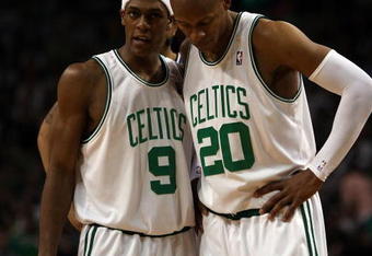 BOSTON - MAY 17:  Rajon Rondo #9 and Ray Allen #20 of the Boston Celtics talk as the Orlando Magic shoot a free throw in Game Seven of the Eastern Conference Semifinals during the 2009 NBA Playoffs at TD Banknorth Garden on May 17, 2009 in Boston, Massachusetts. The Orlando Magic defeated the Boston Celtics 101-82 to advance to the Eastern Conference Finals. NOTE TO USER: User expressly acknowledges and agrees that, by downloading and or using this photograph, User is consenting to the terms and conditions of the Getty Images License Agreement.  (Photo by Elsa/Getty Images)