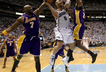 SALT LAKE CITY - MAY 09:  Carlos Boozer #5 of the Utah Jazz is guarded by Lamar Odom #7 and Ronny Turiaf #21 of the Los Angeles Lakers in Game Three of the Western Conference Semifinals during the 2008 NBA Playoffs on May 9, 2008 at Energy Solutions Arena in Salt Lake City, Utah. NOTE TO USER: User expressly acknowledges and agrees that, by downloading and or using this photograph, User is consenting to the terms and conditions of the Getty Images License Agreement  (Photo by Jonathan Ferrey/Getty Images)