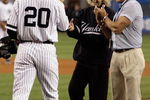 NEW YORK - SEPTEMBER 21: The daughter of Babe Ruth, Julia Ruth Stevens, accepts the ball from Jorge posada #20 after throwing out the ceremonial first pitch as grandson Tom Stevens looks on during pregame ceremonies prior to the start of the last regular season game at Yankee Stadium between the Baltimore Orioles and the New York Yankees on September 21, 2008 in the Bronx borough of New York City. The Yankees are playing their final season in the 85 year old ball park and plan on moving into the new Yankee Stadium across the street to start the 09 season. (Photo by Jim McIsaac/Getty Images) 
