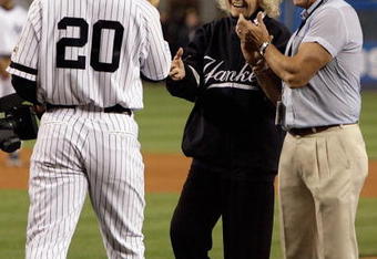 NEW YORK - SEPTEMBER 21: The daughter of Babe Ruth, Julia Ruth Stevens, accepts the ball from Jorge posada #20 after throwing out the ceremonial first pitch as grandson Tom Stevens looks on during pregame ceremonies prior to the start of the last regular season game at Yankee Stadium between the Baltimore Orioles and the New York Yankees on September 21, 2008 in the Bronx borough of New York City. The Yankees are playing their final season in the 85 year old ball park and plan on moving into the new Yankee Stadium across the street to start the 09 season. (Photo by Jim McIsaac/Getty Images) 