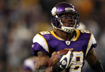 MINNEAPOLIS - DECEMBER 28:  Adrian Peterson #28 of the Minnesota Vikings carries the ball in for a touchdown as James Butler #37 of the New York Giants defends on December 28, 2008 at the Hubert H. Humphrey Metrodome in Minneapolis, Minnesota. (Photo by Elsa/Getty Images)