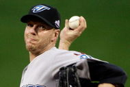 ST LOUIS, MO - JULY 14:  American League All-Star Roy Halladay of the Toronto Blue Jays pitches during the 2009 MLB All-Star Game at Busch Stadium on July 14, 2009 in St Louis, Missouri.  (Photo by Morry Gash-Pool/Getty Images)