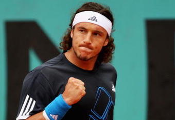 PARIS - MAY 28:  Juan Monaco of Argentina celebrates a point during his Men's Singles Second Round match against Jo-Wilfried Tsonga of France on day five of the French Open at Roland Garros on May 28, 2009 in Paris, France.  (Photo by Clive Brunskill/Getty Images)